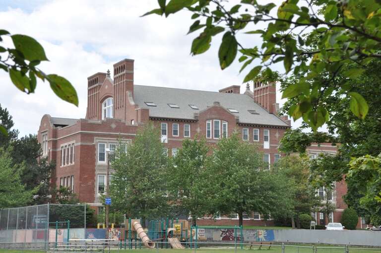 A photograph of the historic Charles A. Daniels School in Malden, Massachusetts.