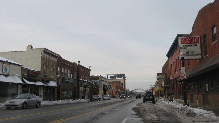 Looking northward from the eastern side of High Street south of the Duncan Street intersection in Columbus, Ohio, United States.  These blocks are part of the North Columbus Commercial Historic District, a historic district that is listed on the