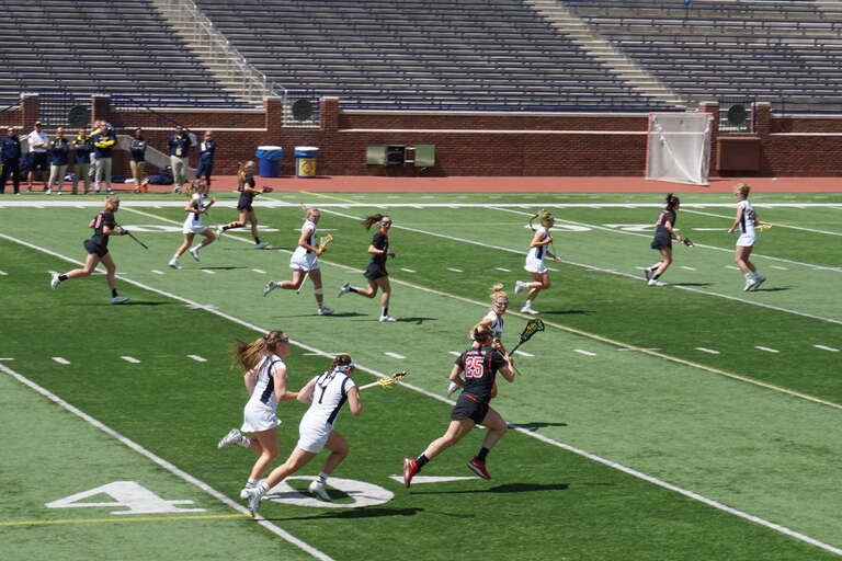 First-half action during the Rutgers Scarlet Knights vs. Michigan Wolverines women's lacrosse game at Michigan Stadium in Ann Arbor, Michigan (United States). Rutgers won 7–6.
