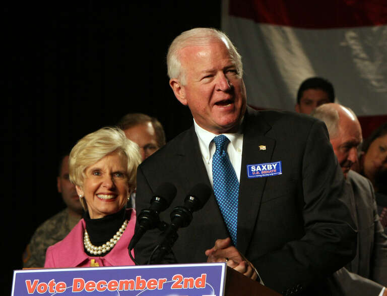 Mrs Chambliss to his left.