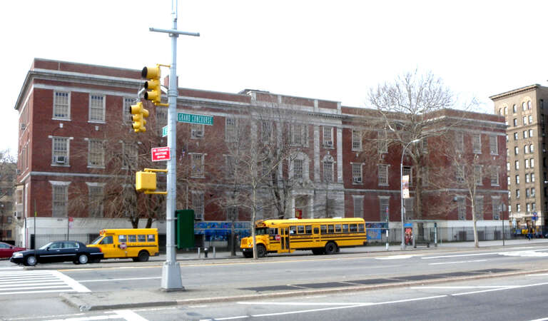 Looking northwest across Grand Concourse and 193d at PS 246 Poe Center School, formerly Society for the Relief of the Destitute Blind, 2461 Grand Concourse, on a cloudy afternoon.