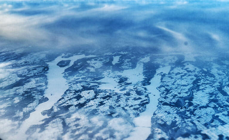 500px provided description: Taken from the plane somewhere over South Dakota. [#landscape ,#clouds]