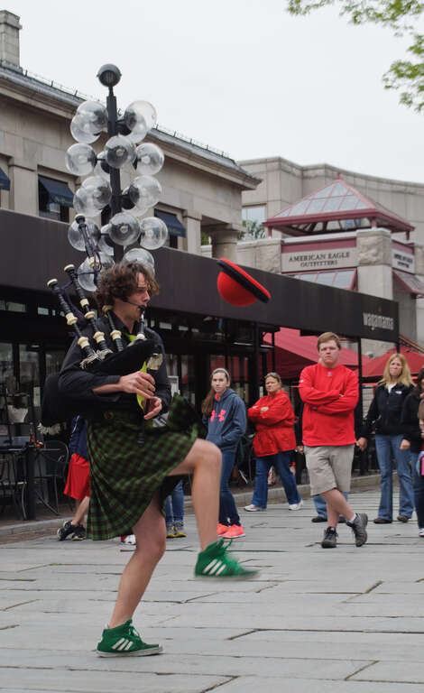Faneuil Hall and Quincy Market are surrounded by portrait artists and street performers who cater to the shoppers and tourists in the area.

I really liked this kilted man, whose act included unicycles, juggling, bagpipes, and more, sometimes all at