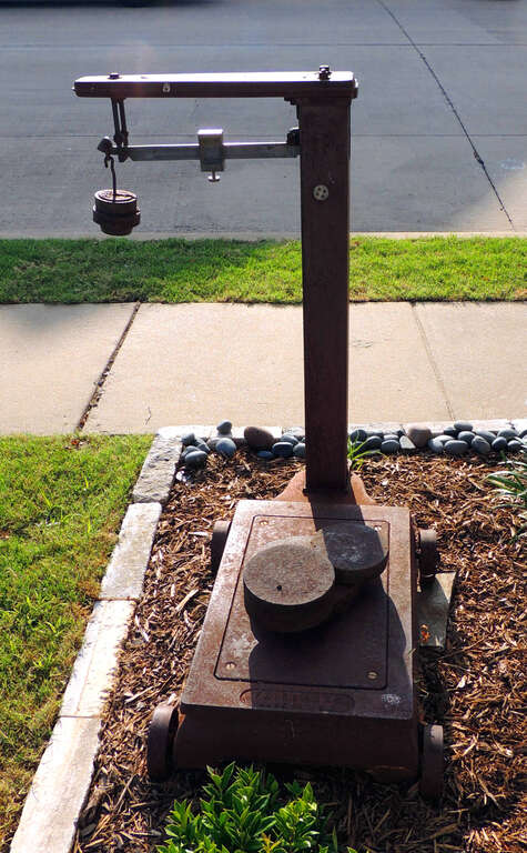 Fairbanks mechanical beam platform scale is constructed with an iron-carbon alloy better known as cast iron. The railway weight scale was used for cargo being loaded and relocated to a determined destination.