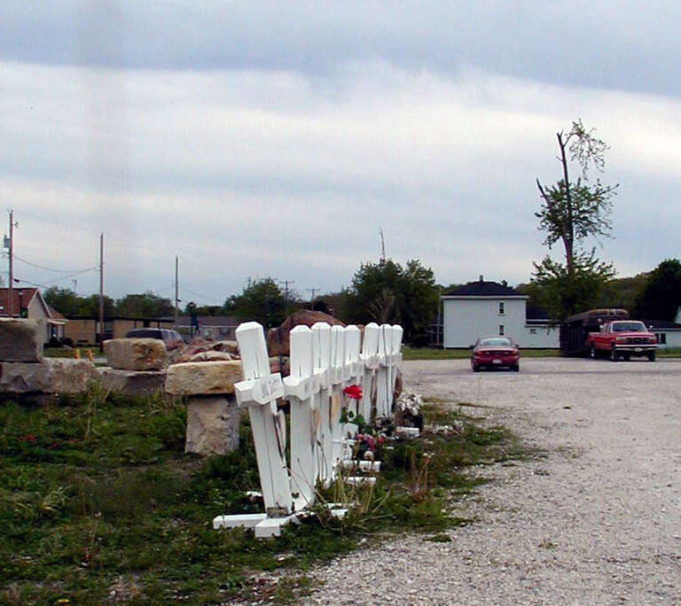 (photo: Crosses for those who died in the Milestone Tap. A ragged tree survived the tornado)
Utica Tornado of April 20, 2004
Story by Julia Keller
First printed December 5, 6, and7 in the Chicago Tribune.

continue to Part 2...