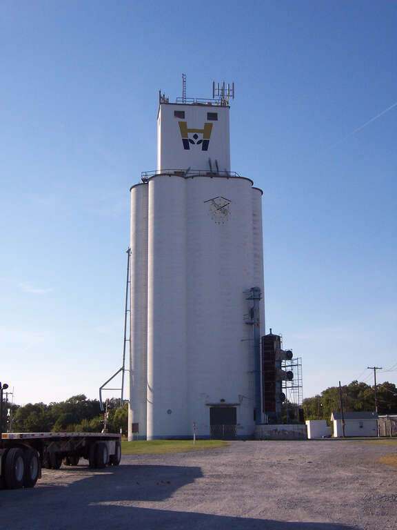 This locally famous grain elevator was built in 1958 in Downtown Broken Arrow, Oklahoma. It is 158 feet tall and is currently the tallest building in downtown Broken Arrow. It can be seen for miles. The grain elevator is still in use today and