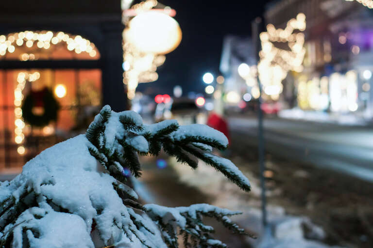 500px provided description: Snow perched on small tree on Main St in Woodstock, Vermont over Christmas. [#street ,#travel ,#night ,#tree ,#small town ,#main street ,#chirstmas lights ,#Bokeh ,#Snow ,#Christmas ,#White ,#USA ,#America ,#Vermont]