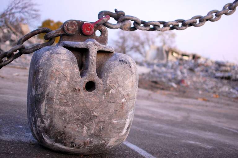 An (apparently unused) office building near our condo recently disappeared, thanks to this guy