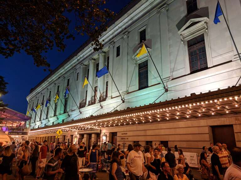 The west face of the en:Eastman School of Music rises above the crowds at the 2018 en:Rochester International Jazz Festival.