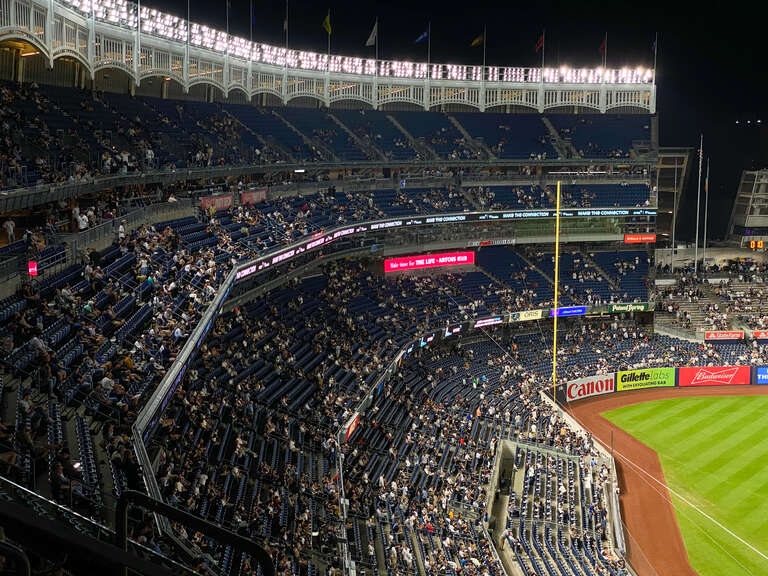 A picture of Yankee Stadium during a game between the Yankees and Pirates.