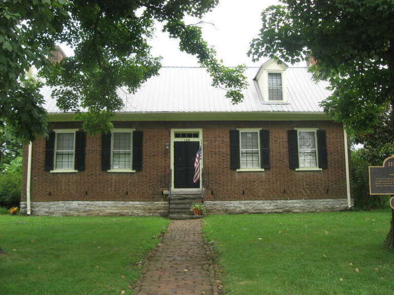 Front of the Archibald Woods House, located at 129 N. East Street in Harrodsburg, Kentucky, United States.  Built in 1810, it is listed on the National Register of Historic Places.