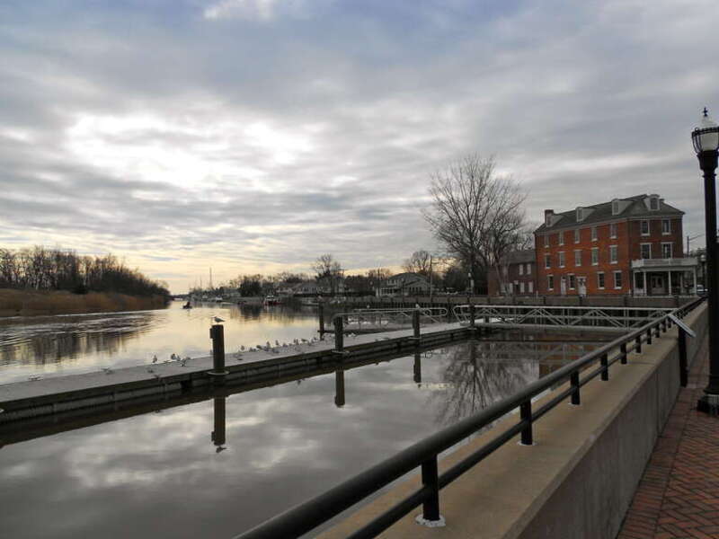 Eastern lock of the Chesapeake and Delaware Canal (now out of use).  The Van Amringe house in the background. Listed as the Eastern Lock of the Chesapeake and Delaware Canal on the NRHP since April 21, 1975, in Battery Park, Delaware City, Delaware.