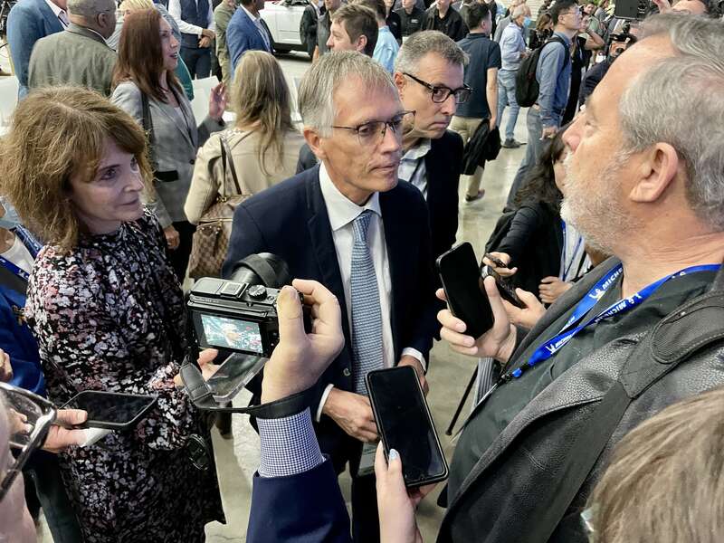 Carlos Tavares accept questions on the show floor after his team's Press Conference.