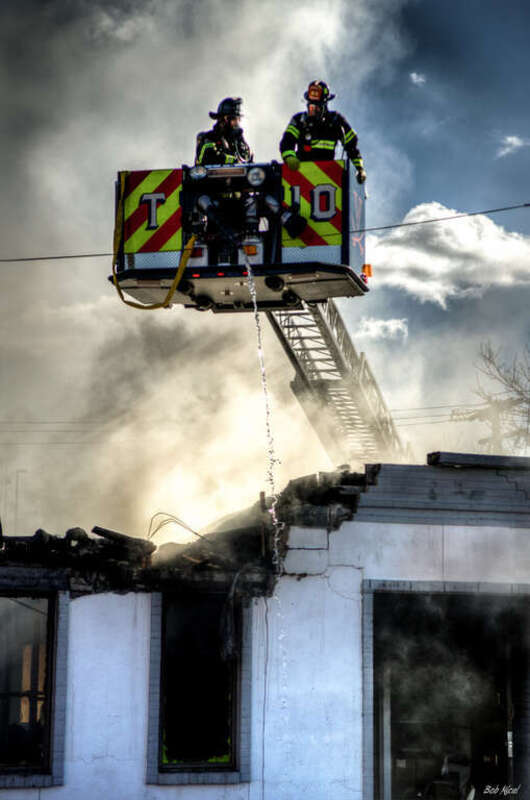 500px provided description: Charlottesville fire department works a fire downtown at the Parks and Rec building. [#fire fighters charlottesville virginia fire deoartment]