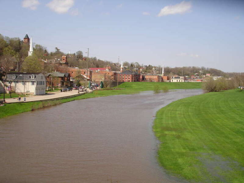 Galena River flowing through downtown Galena, Illinois, USA. The river was abnormally high in this shot. The buildings on the left are members of the Galena Historic District, which is listed on the U.S. National Register of Historic Places.