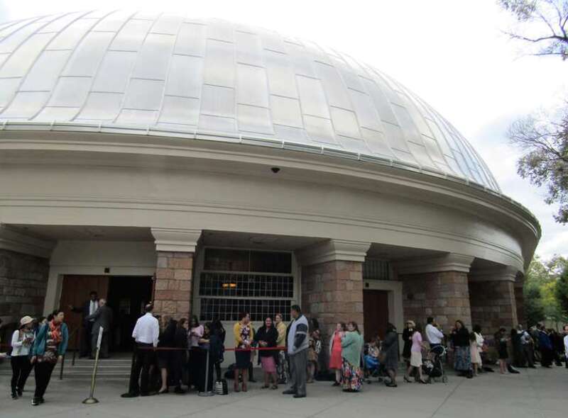 People listening to General Conference outside the Salt Lake Tabernacle.