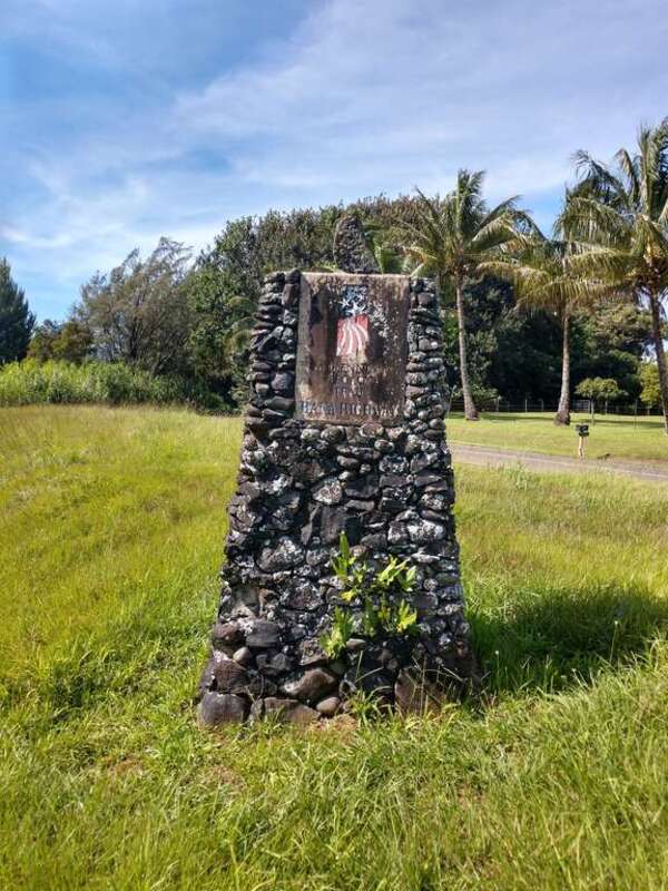 Hana Highway Millennium Trail monument at the junction of Route 36/360 and 365. Kaupakalua Road (Route 365) is to the right; Hana Highway (Route 36/360) would be to the left of the photo.