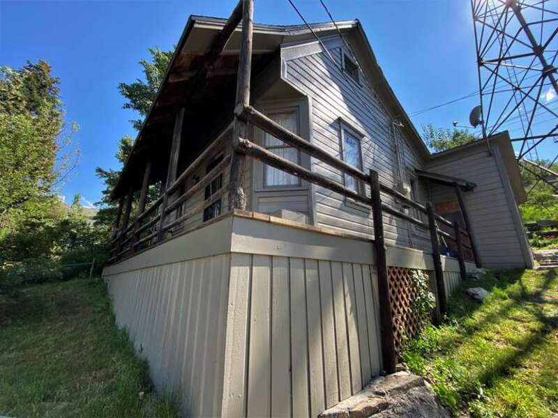 Henry M. Hinsdill House  Site is not easily photographed, as it is located on a steep slope, sandwiched in between a walking path and the chair lift without street access.