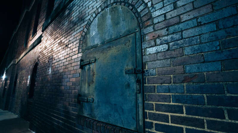 Spooky Metal Door on Wall on Asheville Ghost Tour in North Carolina
Required attribution for all distribution must include a name followed by the active, clickable URL or web address link to the author and owner of the work: US Ghost Adventures