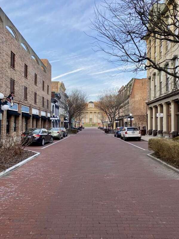 Built in 1827-1837, this Greek Revival-style building was designed by Gideon Shryock to serve as the Kentucky State Capitol.  The building is clad in marble with a hexastyle front portico at the top of a set of front steps with fluted ionic columns,