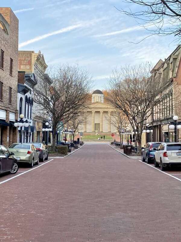 Built in 1827-1837, this Greek Revival-style building was designed by Gideon Shryock to serve as the Kentucky State Capitol.  The building is clad in marble with a hexastyle front portico at the top of a set of front steps with fluted ionic columns,