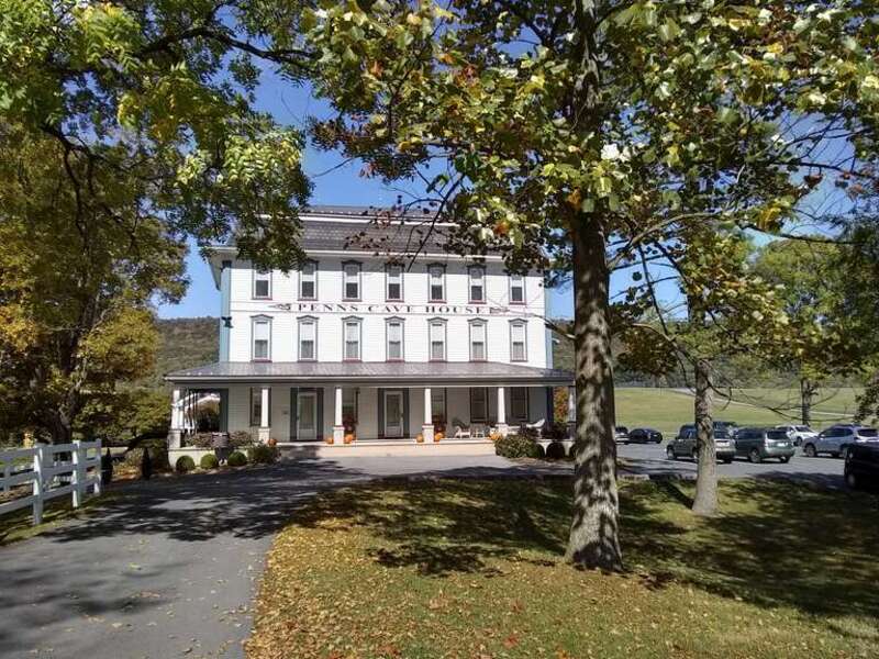 The front exterior of Penn's Cave Hotel, part of the Penn's Cave and Wildlife Park, located in Centre County, Pennsylvania, USA.  The photo was taken in October, 2020.