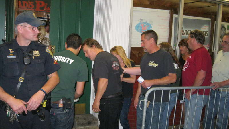 People stand in line outside Toad's Place concert hall in New Haven, CT on 8/6/13 to see Ted Nugent. A protest event was held outside in response to inflammatory remarks made by Ted Nugent regarding the shooting of Trayvon Martin.