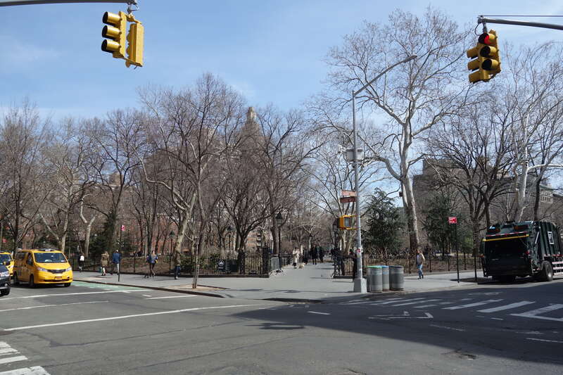 The entrance into the southwest corner of Washington Square Park, at the northeast corner of MacDougal Street (Washington Square West) and West 4th Street (Washington Square South) in Greenwich Village, Lower Manhattan.
