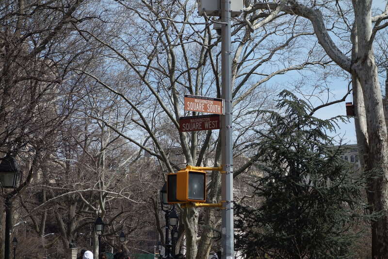 Street signs for the Greenwich Village Historic District in front of Washington Square Park, at the northeast corner of MacDougal Street (Washington Square West) and West 4th Street (Washington Square South) in Greenwich Village, Lower Manhattan.