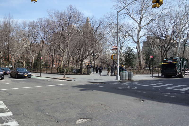 The entrance into the southwest corner of Washington Square Park, at the northeast corner of MacDougal Street (Washington Square West) and West 4th Street (Washington Square South) in Greenwich Village, Lower Manhattan.
