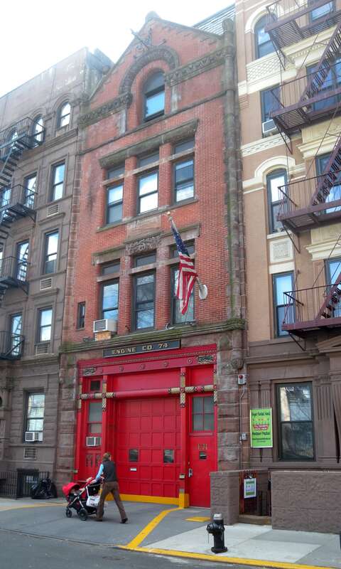 Looking south across 83d Street at Engine 74 firehouse on a sunny day.