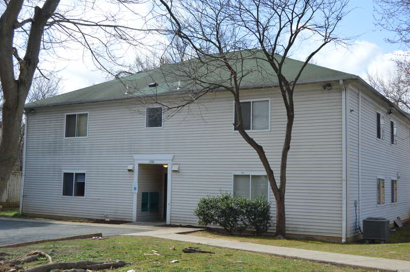 Front of an apartment building located at 1200 Carlton Avenue in Charlottesville, Virginia, United States.  This was formerly the site of the Ficklin-Crawford Cottage, which was listed on the National Register of Historic Places in 1982; although no