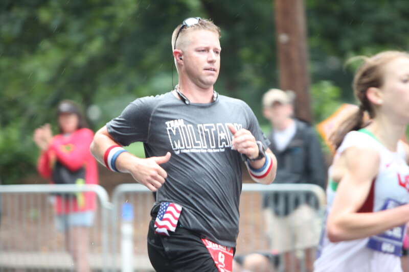 ATLANTA, July 4, 2015 - Georgia Army National Guard Capt. Jonathan Sellars runs hard to complete the Peachtree Road Race within an hour. 

(Georgia National Guard photo by Desiree Bamba / Released)