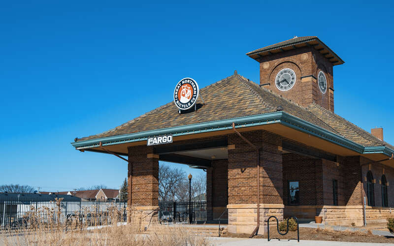 The Great Northern Bicycle Company at 425 Broadway, Fargo, North Dakota - rail station and clock tower building.