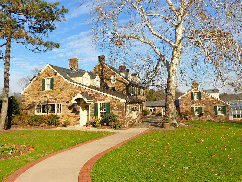 Green Hills Farm, adult home of Pearl S. Buck, a National Historic Landmarks since February 27, 1974. Southwest of Dublin on Dublin/Maple Road, Hilltown Township, Bucks County, Pennsylvania.  The taller house in the middle is 18th century, the rest