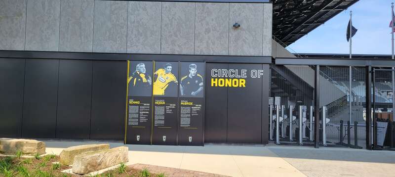 The Circle of Honor, currently consisting of Sigi Schmid, Frankie Hejduk, and Brian McBride, located at the northwestern entrance of Lower.com Field.