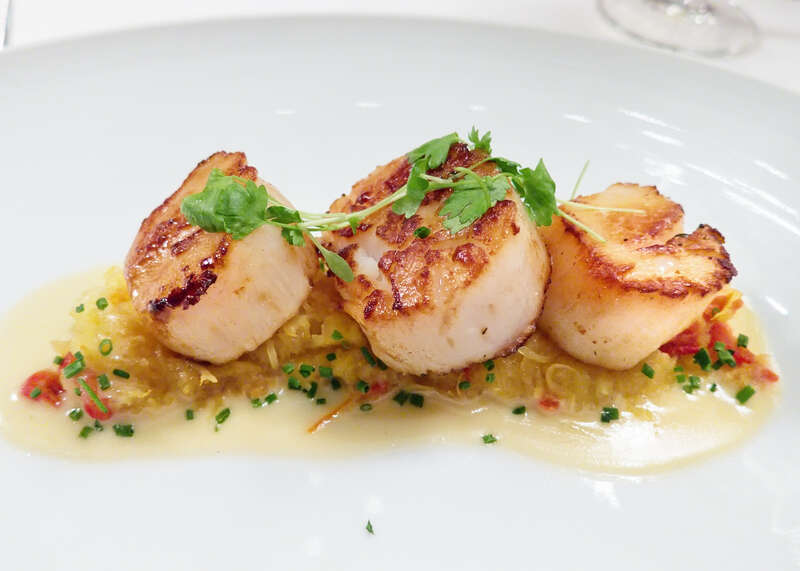 Seared Diver Sea Scallops with spaghetti squash, tomato confit &amp;amp; lemon garlic butter at the Metropolitan Opera's Grand Tier restaurant.  

It looked so good that Jenny took it from me.