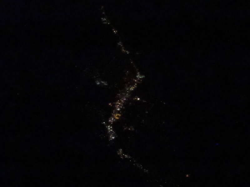 Taken during an evening flight from Chicago-Midway to Las Vegas while flying over one of my favorite towns in the United States.  Moab is a city in Grand County, in eastern Utah, in the western United States. The population was 4,779 at the 2000