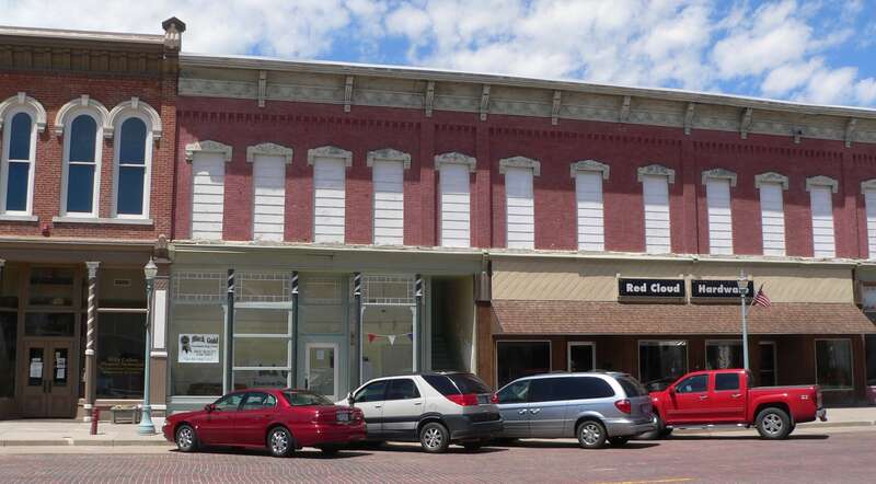 Southern portion of Moon Block, located on west (odd-numbered) side of the 400s block of North Webster Street in Red Cloud, Nebraska.  The building was constructed in 1886.  It consists of five storefronts, three of which are shown in the photo.  It