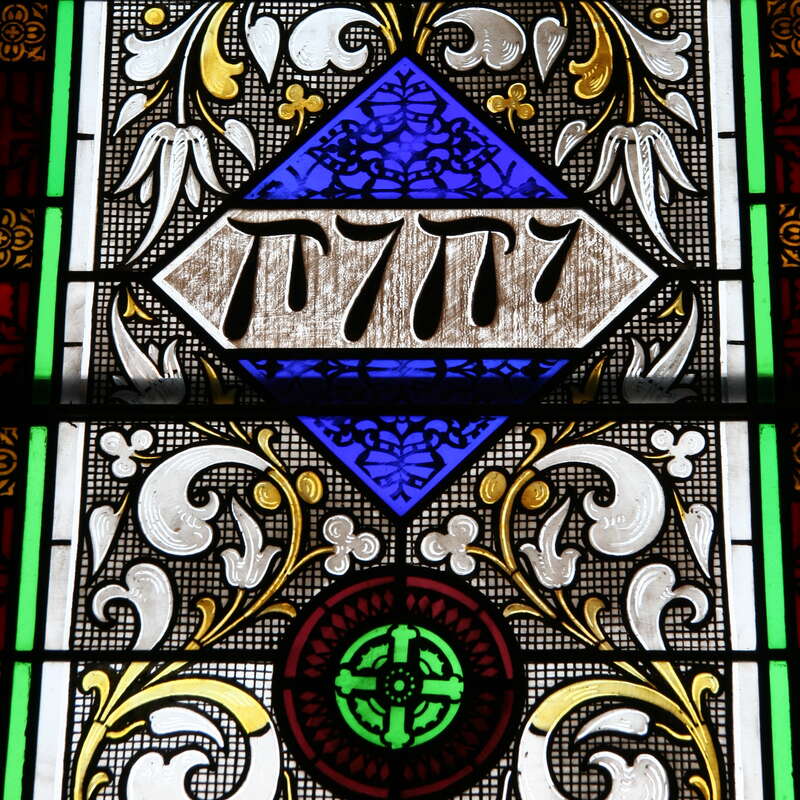 Detail of a stained glass window featuring a representation of the Tetragrammaton installed in Grace Episcopal Church soon after 1868 when the church was built in Decorah, Iowa