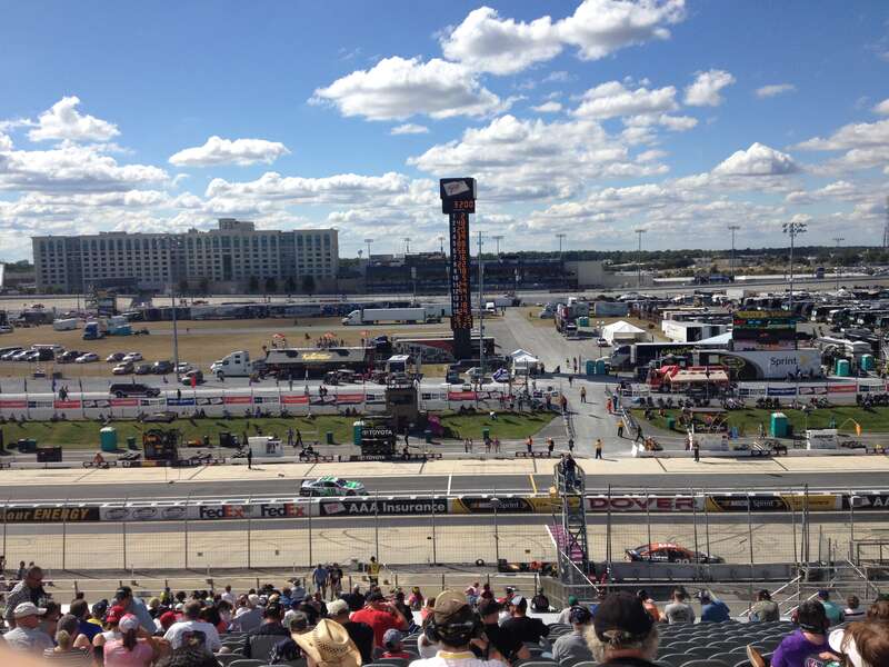 Final practice for the 2013 AAA 400 at Dover International Speedway viewed from the start/finish line. Ryan Newman (#39) is on the track while Kyle Busch (#18) is driving down pit road.