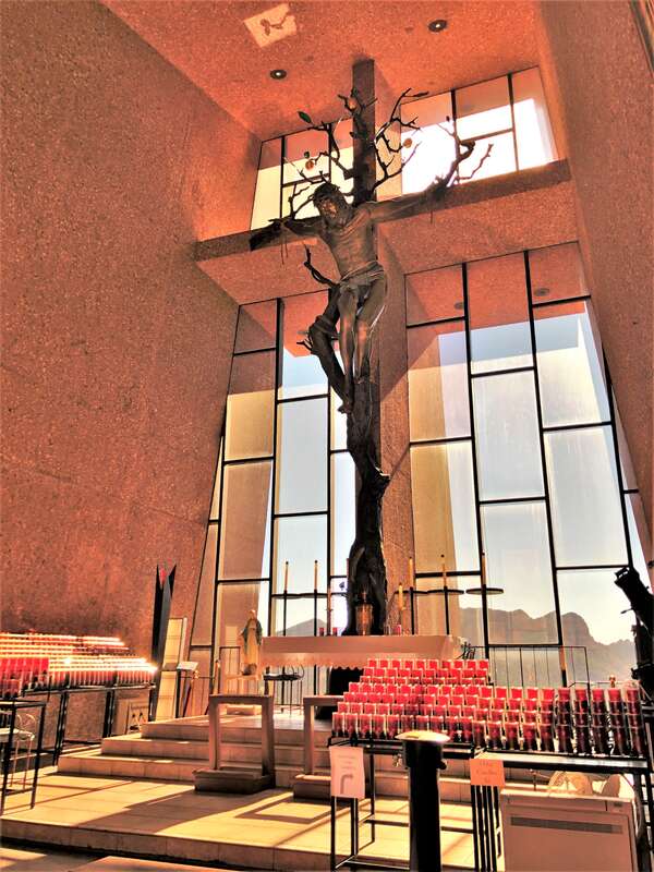 The Chapel of the Holy Cross is a Roman Catholic chapel built from 1954 to 1956 into the red rock buttes of Sedona, Arizona, within the Coconino National Forest. It was inspired and commissioned by local rancher and sculptor Marguerite Brunswig