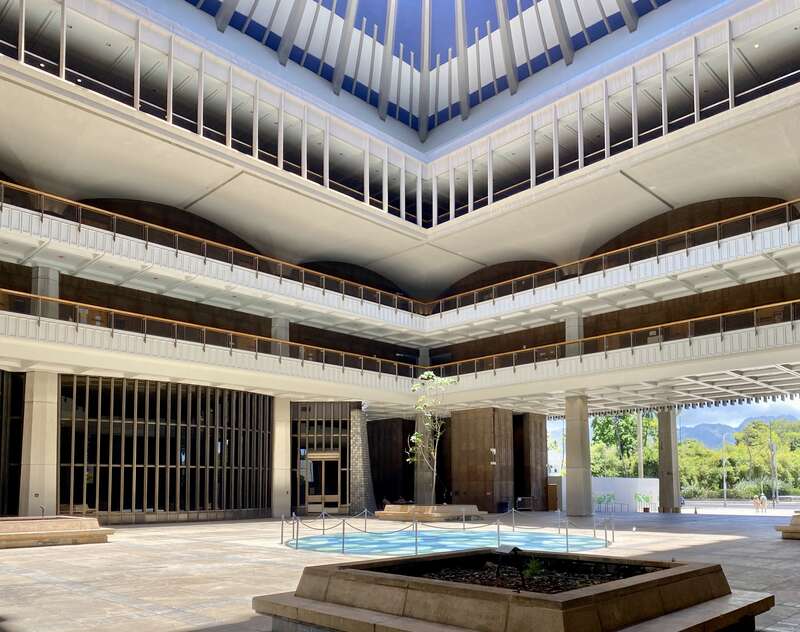 Built between 1965 and 1969, this modernist State Capitol building was designed by Belt, Lemon and Lo of Architects Hawaii Ltd., and John Carl Warnecke and Associates.  The building was built in a variant of Modernism known as the “Hawaiian