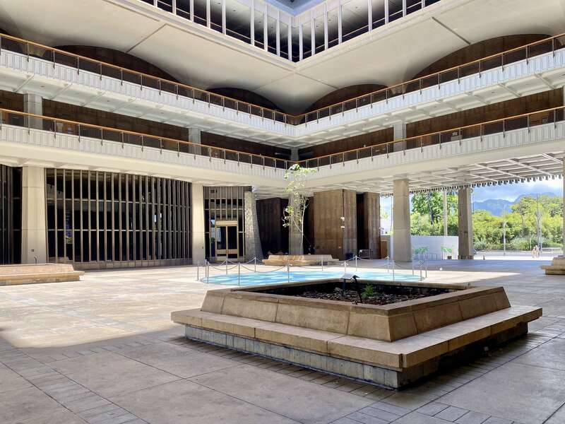 Built between 1965 and 1969, this modernist State Capitol building was designed by Belt, Lemon and Lo of Architects Hawaii Ltd., and John Carl Warnecke and Associates.  The building was built in a variant of Modernism known as the “Hawaiian