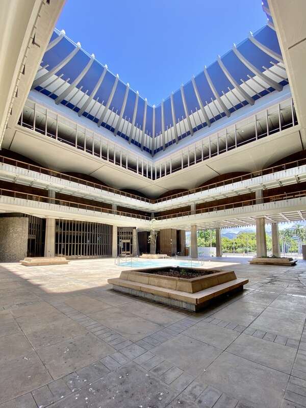 Built between 1965 and 1969, this modernist State Capitol building was designed by Belt, Lemon and Lo of Architects Hawaii Ltd., and John Carl Warnecke and Associates.  The building was built in a variant of Modernism known as the “Hawaiian