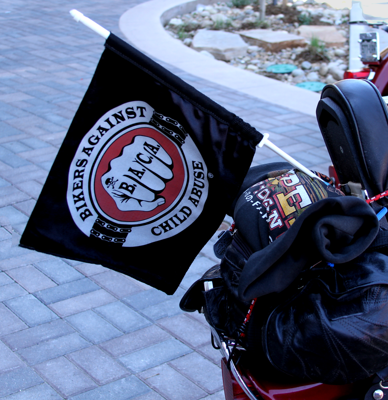 Bikers against child abuse flag on the back of a motorcycle