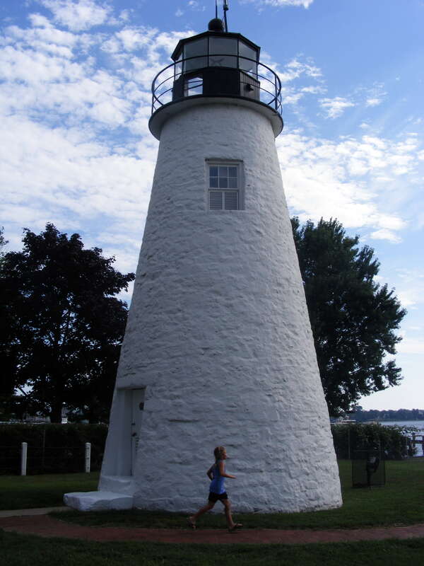 Emmy runs past lighthouse