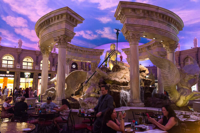 The Fountain of the Gods at Caesars Palace (Las Vegas) with a Louis Vuitton store in the background.