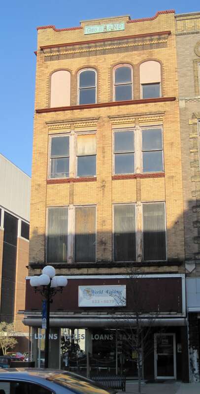 The George Brand Building in the Bloomington Central Business District (1900). Brand operated a furniture and upholstery business. This building was built within 130 days of the fire that destroyed the original establishment. Illinois Power operated