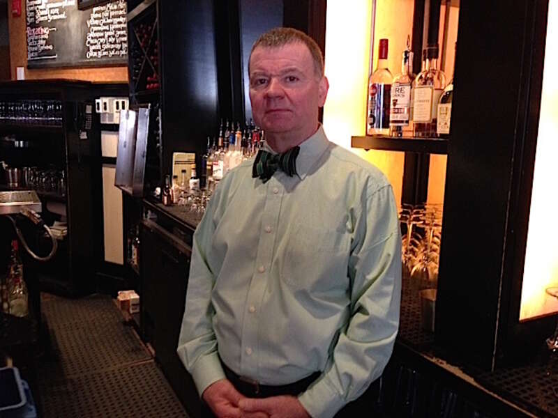 Paul Barry behind the bar at Grafton Street in Harvard Square
